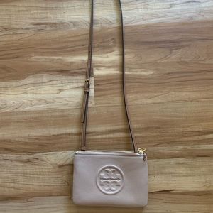 Tory Burch. Purse. Like new. Never used. Cute tan color, goes with everything.